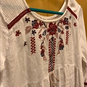 White blouse with embroidered flowers. Very cute!